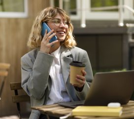 smiley-woman-talking-phone-medium-shot